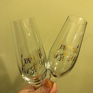 two “love at first sip” wedding champagne flutes